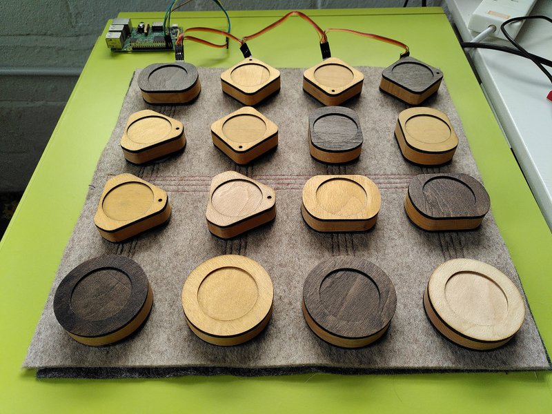 The finished article, showing connections and tangible interface blocks in place and a Raspberry Pi in the background