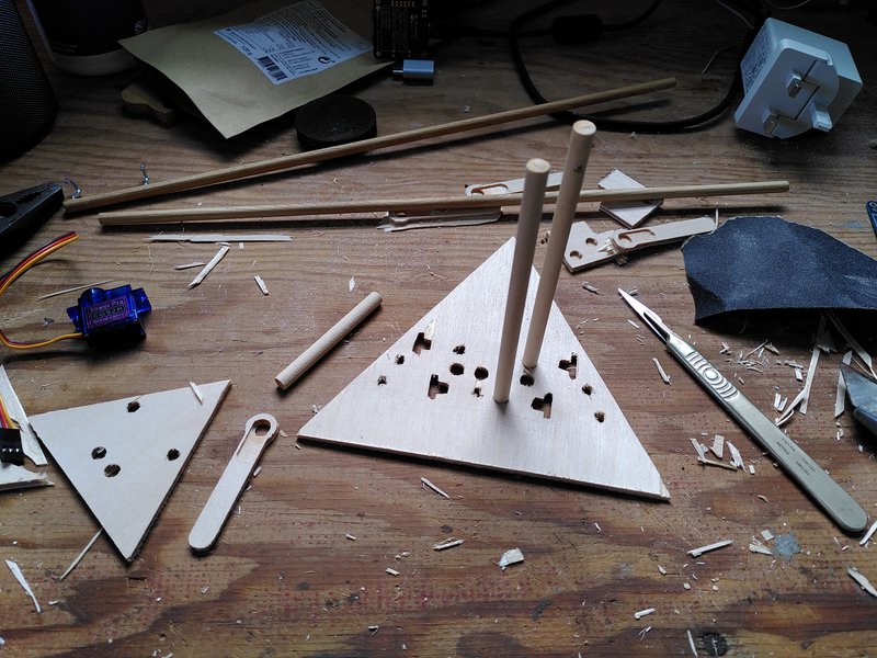 Assembling the third prototype, attaching the dowel into the triangular end supports.