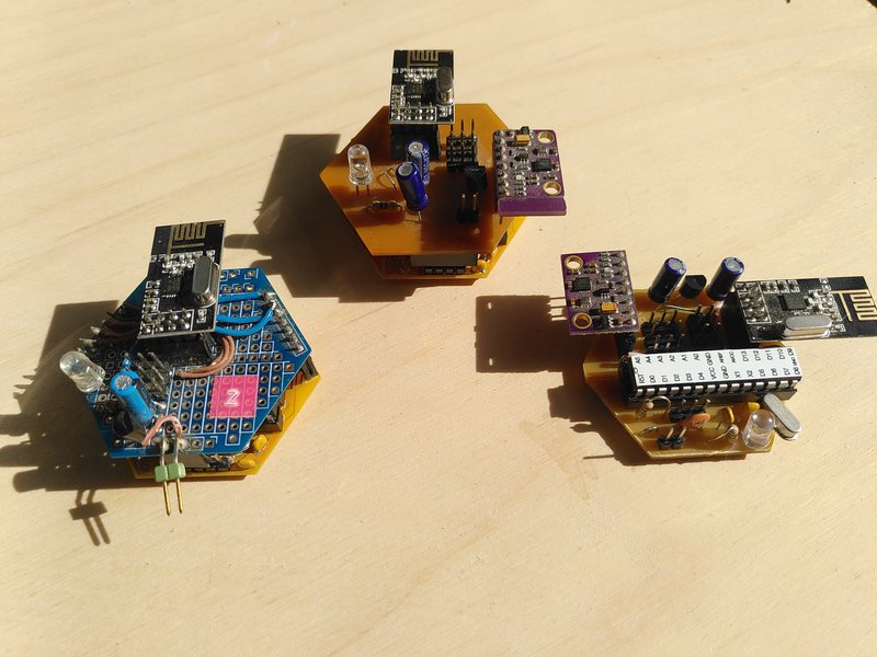 Three circuit boards, two on the left are double height, with radio and sensor modules attached