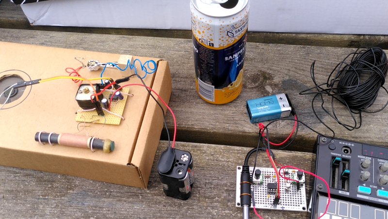 A crystal radio built from a cardboard box using a pyrite crystal, a small circuit board transmitter and the corner of a volca fm synthesiser