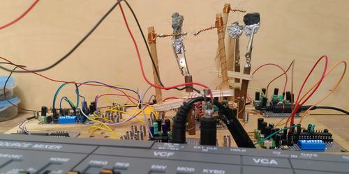 Crystals and cat's whiskers over diy circuit boards with an SH101 synth in the foreground.