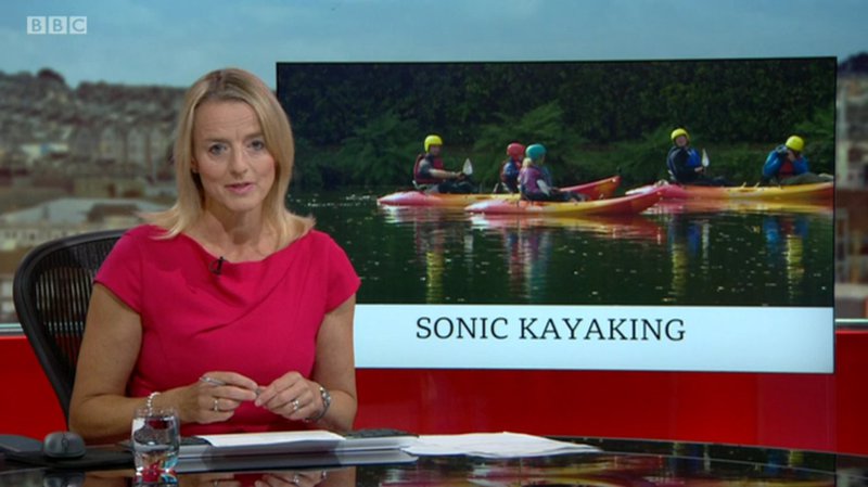 BBC spotlight presenter with sonic kayaks in the background image